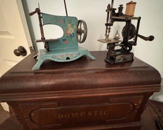 Antique small scale, sewing machines or toy or child sewing machines