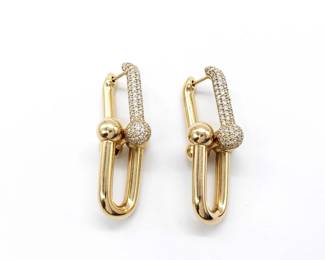 Bold Tiffany & Co. HardWear Large Link earrings crafted in solid 18K yellow gold and accented with pavé-set diamonds. The iconic industrial-inspired link design is enhanced with diamond pavé detailing, creating a striking balance between modern edge and refined luxury. A signature statement piece from Tiffany’s celebrated HardWear collection.