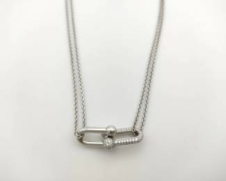 Sophisticated Tiffany & Co. HardWear necklace crafted in solid 18K white gold and accented with pavé-set diamonds. The design features the iconic double link motif from the HardWear collection, combining bold industrial inspiration with elegant diamond detailing for a modern and refined statement piece. A distinctive creation from Tiffany’s celebrated HardWear line.