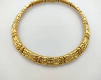 This substantial necklace is crafted in solid 18K yellow gold and features a bold articulated link design with strong sculptural presence. The fluid, dimensional construction creates a powerful yet refined statement, reflecting exceptional fine jewelry craftsmanship. A timeless and highly wearable luxury piece suitable for both daily wear and formal occasions.