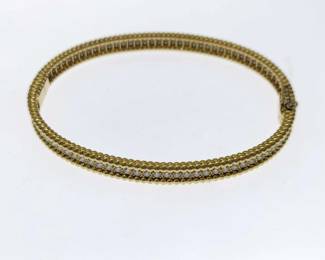 This elegant Van Cleef & Arpels Perlee bangle bracelet is crafted in solid 18K gold and features brilliant diamonds set within the collection’s signature beaded gold design. The refined form reflects the timeless aesthetic and craftsmanship of the Perlee collection. Featuring the desirable Large size fit, this bracelet represents a collectible and sought-after example from Van Cleef & Arpels.