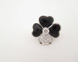 This elegant Van Cleef & Arpels Cosmos brooch is crafted in solid 18K gold and features the iconic floral motif, set with richly colored black onyx petals accented by brilliant diamonds. The refined layered design creates exceptional contrast and dimension, showcasing Van Cleef & Arpels’ renowned attention to detail and timeless aesthetic. Featuring the highly sought-after Cosmos configuration and classic gemstone combination, this brooch represents a more collectible and desirable example from Van Cleef & Arpels’ celebrated fine jewelry collection.