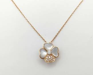 Description: This elegant Van Cleef & Arpels Cosmos brooch pendant necklace is crafted in solid 18K gold and features the iconic floral motif, set with luminous white mother of pearl petals accented by brilliant diamonds. The refined layered design creates exceptional radiance and depth, highlighting the natural iridescence of the mother of pearl and the brilliance of the diamonds. Featuring a versatile brooch and pendant configuration and highly sought-after Cosmos design, this piece represents a more collectible and desirable example from Van Cleef & Arpels’ celebrated fine jewelry collection.