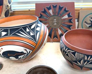 Assorted Pueblo pottery and sandpaintings