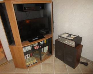 1980's TV unit with vintage cookbooks, newer flat screen