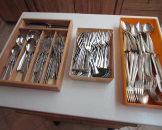 Several sets of flatware