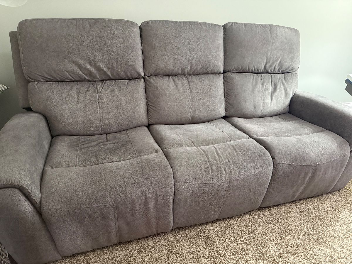 Electric reclining sofa with charging capabilities 