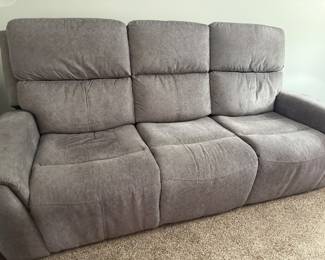 Electric reclining sofa with charging capabilities 