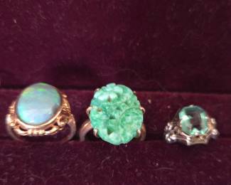 Collection of Three Rings: Opal, Carved Jade, and Green Stone