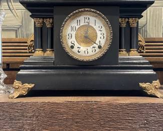Ebonized mantle clock with gilt ormalu