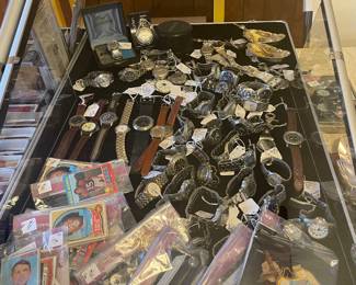 Large collection of men’s wrist and pocket watches, vintage 2960’s and 70’s baseball cards and military paraphernalia 