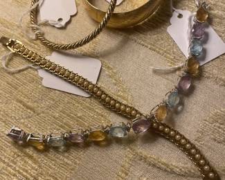 14karat bangles, pearl tennis bracelet and topaz, amethyst and aquamarine bracelet