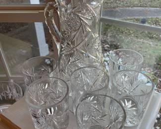 Cut glass pitcher and a set of tumblers