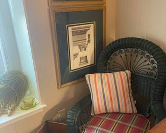 One of a pair of green wicker armchairs