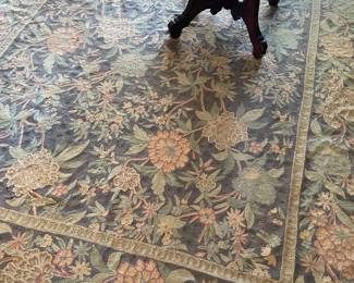 6’ x 9’ crewel rug in living room 