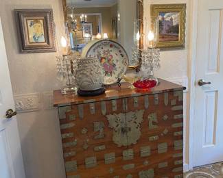 View of entry hall with teak Asian chest and wonderful French mirror 