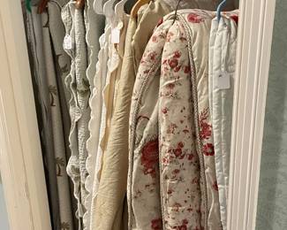 Closet of bedspreads and quilts 