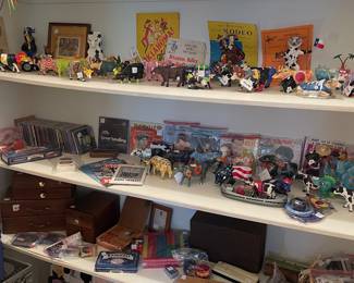 View of game and toy closet with Cow Parade cow collection and vintage toys 