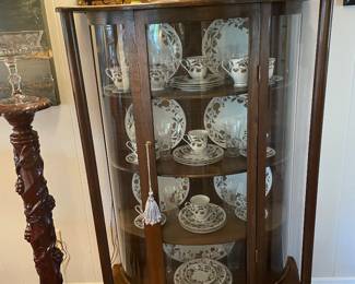 Turn of the century oak curved glass china cabinet 