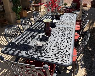 8’ metal patio table, 8 chairs & 2 leafs