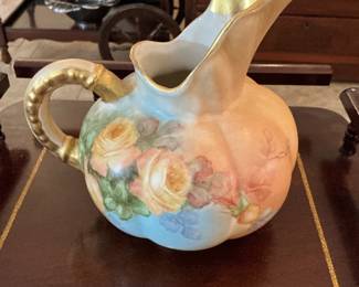 Antique and painted water pitcher