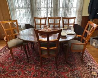 Dining room table, 2 captains chairs, 4 side chairs, 2 leaves and pads (all sold separately - rug NFS)