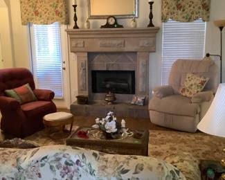 Candle sticks on mantel with clock.