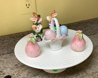 Beautiful white ceramic cake stand with some sweet Easter items.