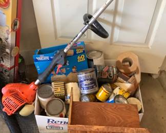 Box if paint and weed eater.