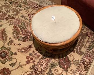 The ottoman of the bamboo bottom and upholstered top.