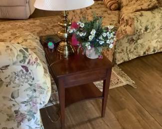 Close up of one of the beautiful end tables with floral arrangement.