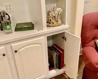 Records under cabinet.