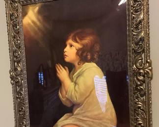 Gorgeous picture of child praying in gorgeous frame.