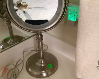 Big round facial mirror.