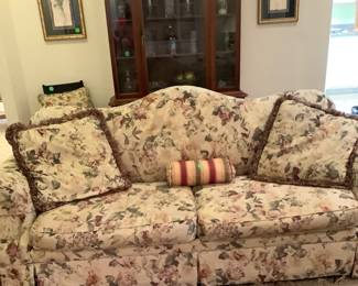 Beautiful beige background Lazy Boy couch, 86”, 2 cushions with green leaves and rose colored flowers.  Price: $245,00