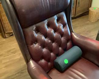 Leather desk chair.  Has rollers.