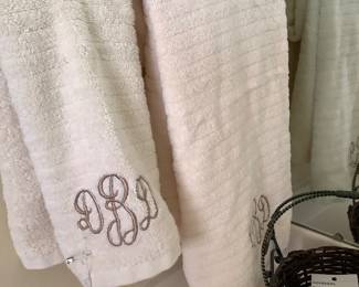 Cream colored embroidered towels.