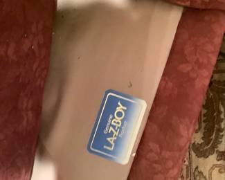 Showing Lazy Boy label in rose colored club chair.