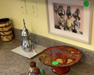 Beautiful Mexican cake stand and has matching salt and pepper shakers.