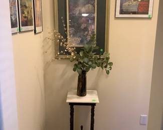 Antique plant stand with marble top.