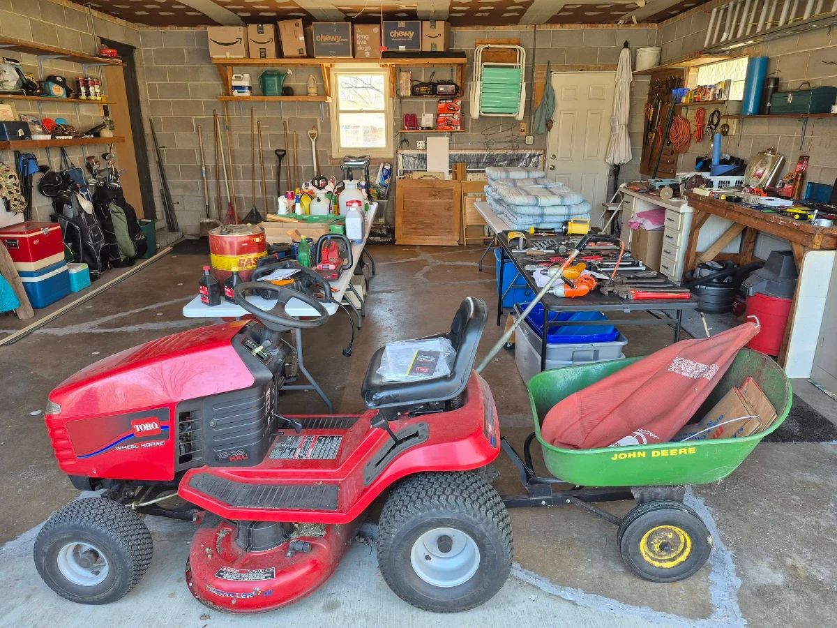 Since I usually come in through the garage...we will start here with my Dad's Toro with its John Deere trailer. It works great and is ready for Spring.