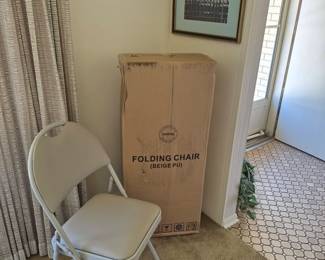 Four extremely comfortable folding chairs new in box.
