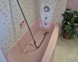 Even the tub is pink!  The pole is the original shower curtain pole.  
