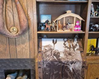 Breyers horses.  Under the Indian scarf is a full shelf of vintage National Geographics.