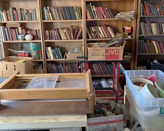 There are several shelves of books to explore, then buy and take home.