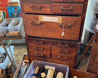 More tool storage cabinets (look in the drawers) and a few mystery canvas-wrapped tool sets below.