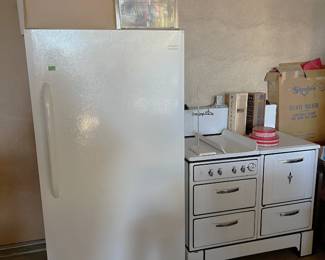 This photo shows the Frigidaire and the vintage stove/oven with a CP label on the front.  This is possibly a Wedgewood.