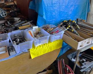It's said "you can never have enough clamps".  I think this sale might try to prove that idea wrong.  Also seen here are a box of chisels, long jaw clamps, metal C clamps, and more.