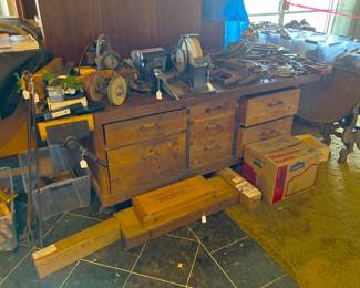 This is another classic workbench, with at least a front vice, and possibly a tail vice.  Drawers, of course, and a few of the bench-mounted power tools.