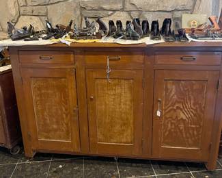 This cabinet is supporting a lot more of the hand and bench planes.  I also see a fillister plane, along with other specialty planes